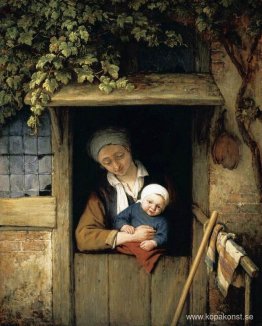 Mamma håller sitt barn i en dörröppning