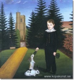 Ung pojke som matar kaniner