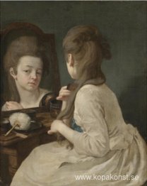 Ung dam på hennes toalett som kammar håret