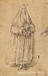 Stående kvinna som håller en muff vänd åt höger