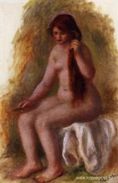 Sittande naken kammar sitt hår