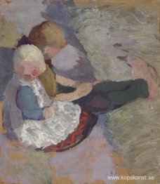 Två barn sitter på en äng