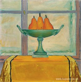 Fruktskål med tre röda och gula päron