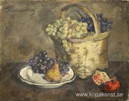 Stilleben. Vindruvor och granatäpplen.