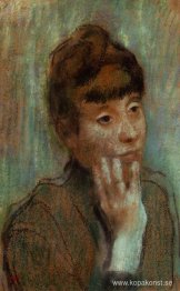 Porträtt av en kvinna som bär en grön blus