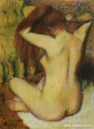 Kvinna som kammar sitt hår