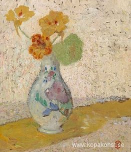 Tre blommor i en vas