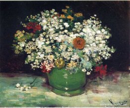 Vas med Zinnias och andra blommor