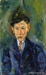 Ung man som bär en liten hatt