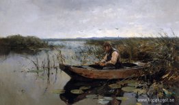 Fiskare på en polderkanal Fiskare på en polderkanal