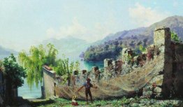 En fiskare som hänger fiskenät En fiskare som hänger fiskenät