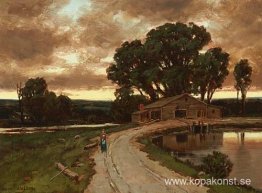 Figur på vägen och bondgården vid solnedgången Figur på vägen och bondgården vid solnedgången