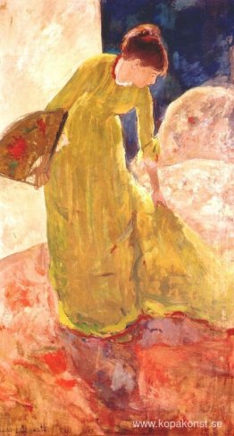 Kvinna som står och håller en fläkt Kvinna som står och håller en fläkt