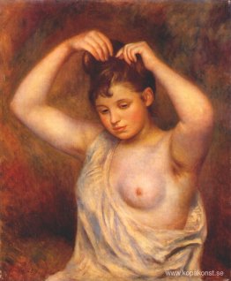 Kvinna som kammar sitt hår Kvinna som kammar sitt hår