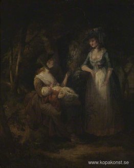 Två kvinnor med en baby som samtalar i en trä Två kvinnor med en baby som samtalar i en trä